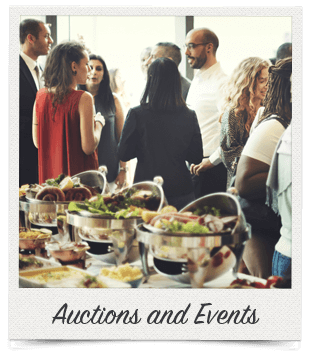A social event with a group of people in conversation standing behind a buffet table, labeled "Auctions and Events."