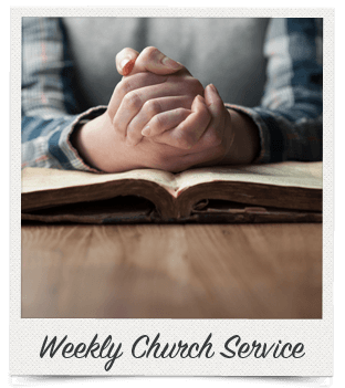A person's clasped hands resting on an open book, likely a Bible, on a wooden surface, captioned "Weekly Church Service."